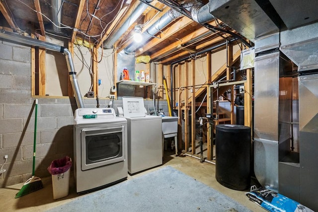12201 Olive St NW, Coon Rapids, MN 55448 - unfinished basement featuring separate washer and dryer and a sink
