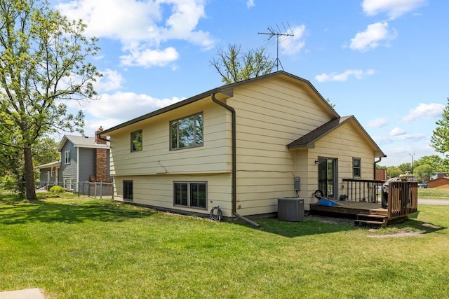 12201 Olive St NW, Coon Rapids, MN 55448 - rear view of house featuring a deck and central AC unit