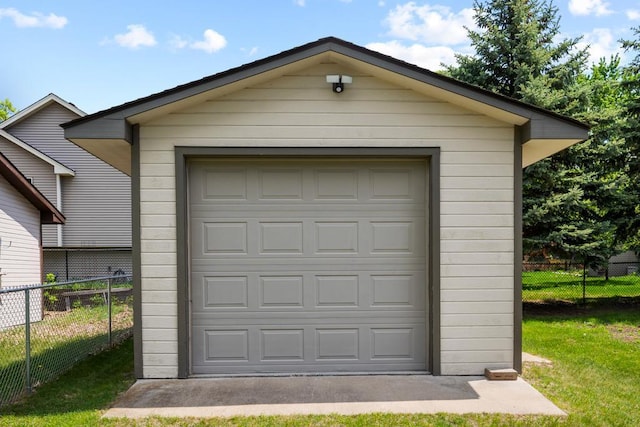12201 Olive St NW, Coon Rapids, MN 55448 - detached garage featuring a storage unit