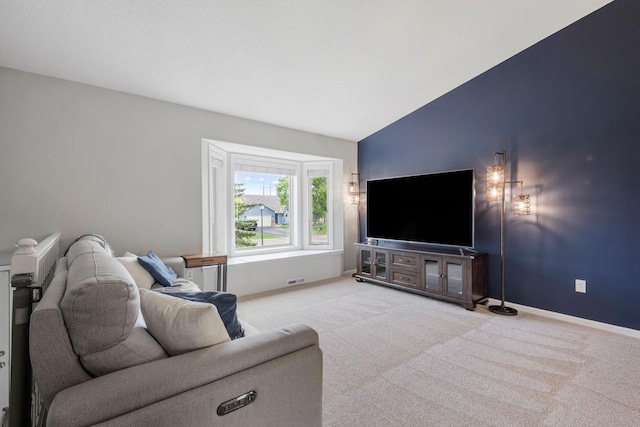 5046 Mitchell Rd, Big Lake, MN 55309 - living area with carpet flooring, vaulted ceiling, and baseboards