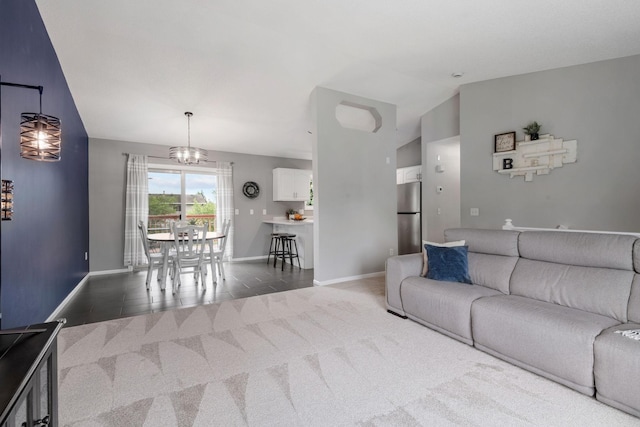 5046 Mitchell Rd, Big Lake, MN 55309 - living room with vaulted ceiling, baseboards, carpet flooring, and a chandelier