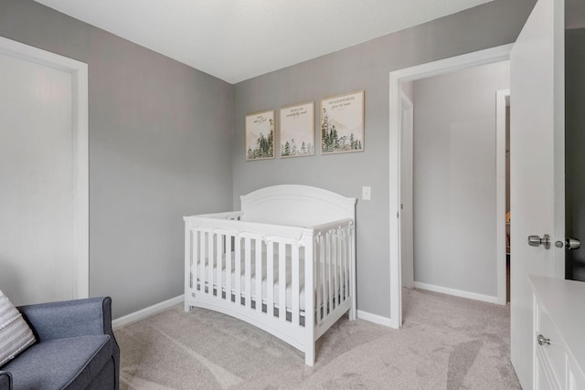 5046 Mitchell Rd, Big Lake, MN 55309 - bedroom with light carpet, baseboards, and a nursery area