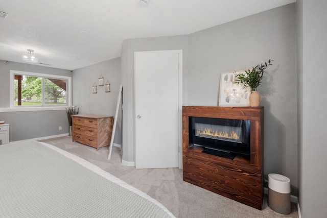 5046 Mitchell Rd, Big Lake, MN 55309 - carpeted bedroom featuring a glass covered fireplace and baseboards