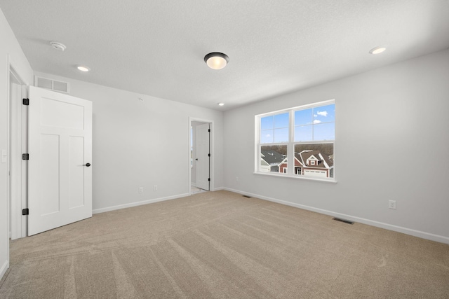 6738 Wildflower Way, Minnetrista, MN 55331 - carpeted spare room with baseboards, recessed lighting, and a smoke detector