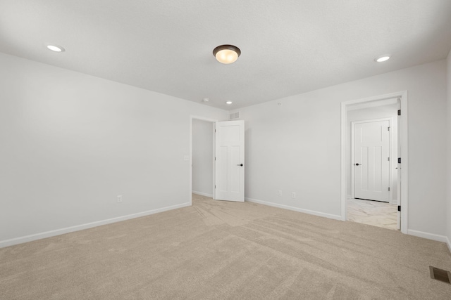 6738 Wildflower Way, Minnetrista, MN 55331 - unfurnished room with light carpet, baseboards, and recessed lighting