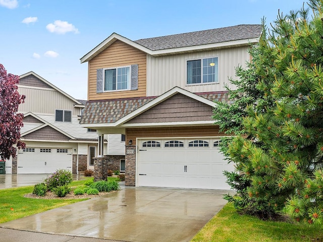 9185 Golden Pond Ln N, Monticello, MN 55362 - view of front of house with a shingled roof, concrete driveway, board and batten siding, and an attached garage