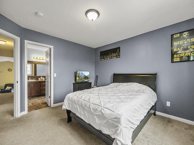 9185 Golden Pond Ln N, Monticello, MN 55362 - bedroom featuring carpet floors, baseboards, ensuite bath, and a textured ceiling