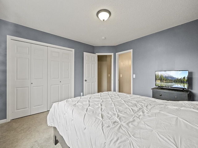 9185 Golden Pond Ln N, Monticello, MN 55362 - carpeted bedroom with a closet and a textured ceiling