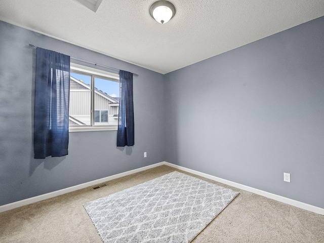 9185 Golden Pond Ln N, Monticello, MN 55362 - carpeted spare room featuring a textured ceiling and baseboards