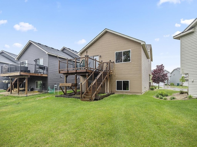 9185 Golden Pond Ln N, Monticello, MN 55362 - rear view of house featuring a wooden deck, a lawn, and stairway