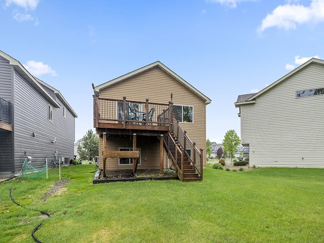 9185 Golden Pond Ln N, Monticello, MN 55362 - rear view of house with a wooden deck, stairway, and a lawn