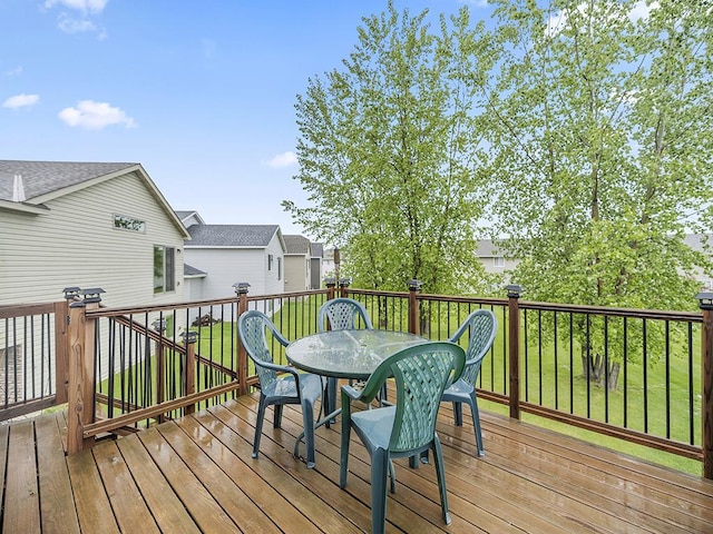 9185 Golden Pond Ln N, Monticello, MN 55362 - deck with outdoor dining space and a lawn