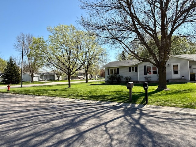 view of front of home with a front yard