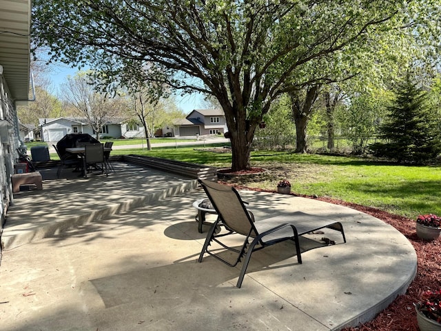 view of patio featuring outdoor dining area and a residential view
