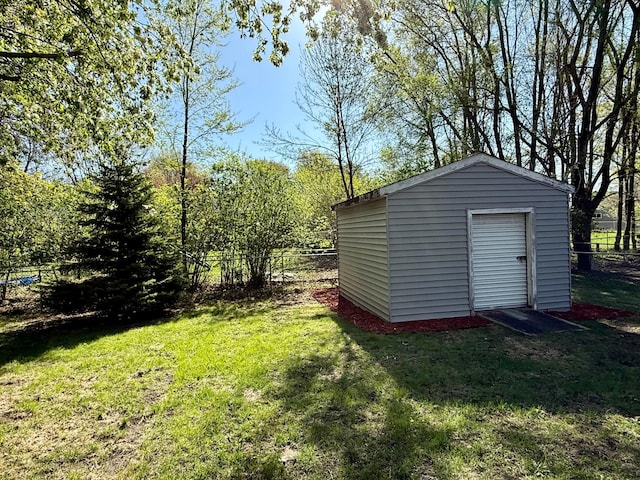 view of shed featuring fence