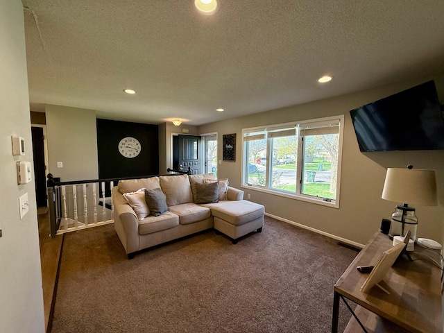 living room with carpet flooring, a textured ceiling, baseboards, and recessed lighting