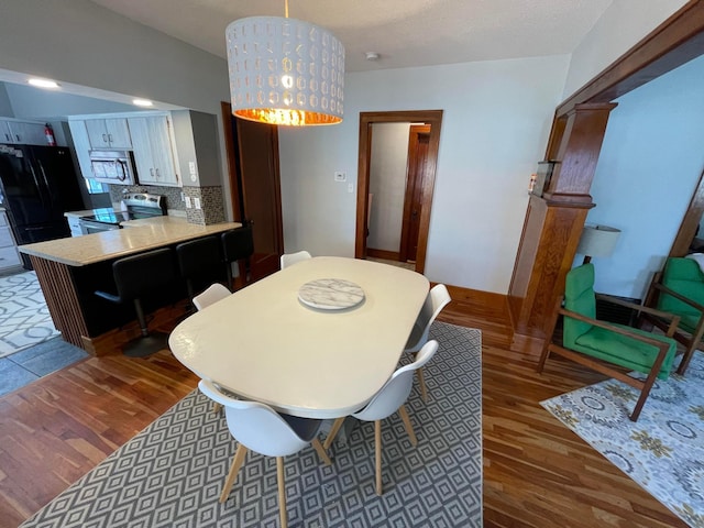dining room featuring wood finished floors