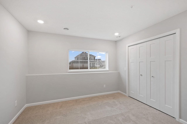 6754 Wildflower Way, Minnetrista, MN 55331 - unfurnished bedroom with carpet flooring, recessed lighting, baseboards, and a closet