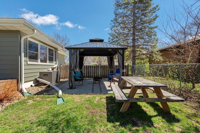 view of yard featuring a fenced backyard, a gazebo, and a patio