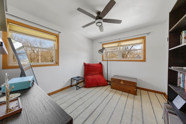 sitting room featuring plenty of natural light, baseboards, and carpet floors