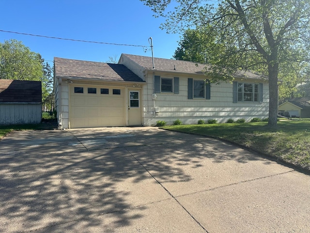 view of front of home with an attached garage and driveway