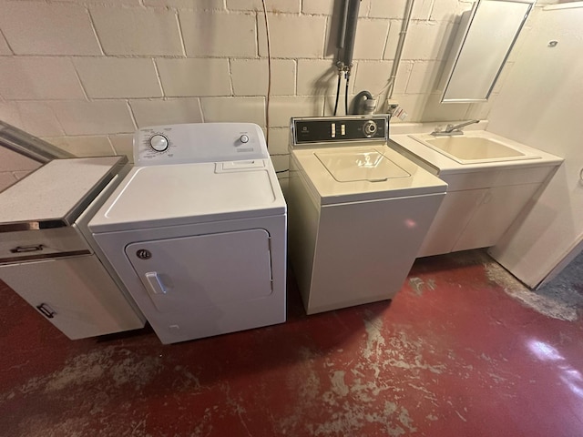 clothes washing area with independent washer and dryer