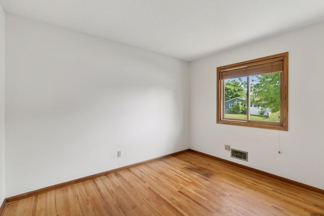 3697 75th St E, Inver Grove Heights, MN 55076 - empty room with baseboards and light wood finished floors