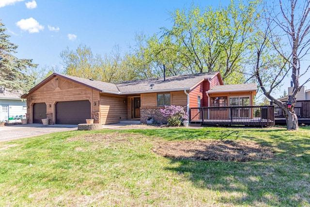 view of front of property with a garage, asphalt driveway, and a front lawn