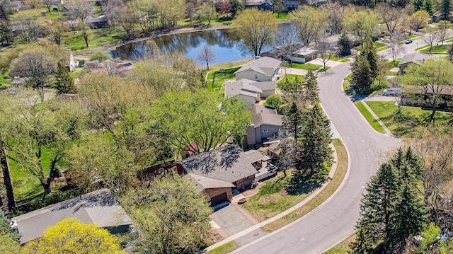 aerial perspective of suburban area with a nearby body of water