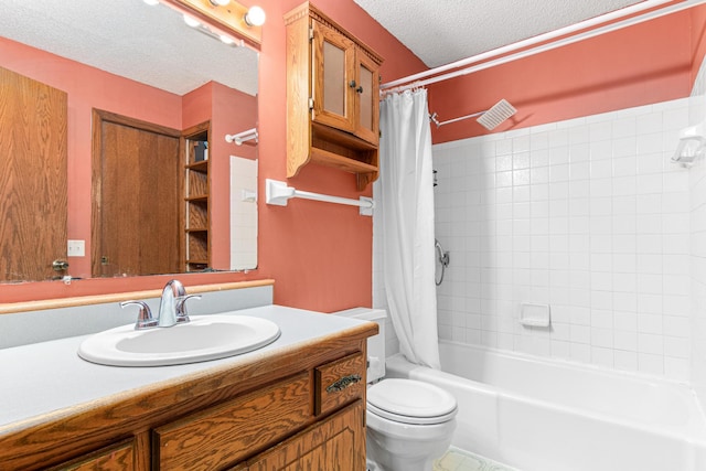 bathroom featuring a textured ceiling, toilet, vanity, and shower / tub combo with curtain