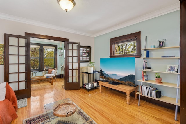 1828 Clinton Ave Unit 3, Minneapolis, MN 55404 - living room with french doors, crown molding, plenty of natural light, and wood finished floors