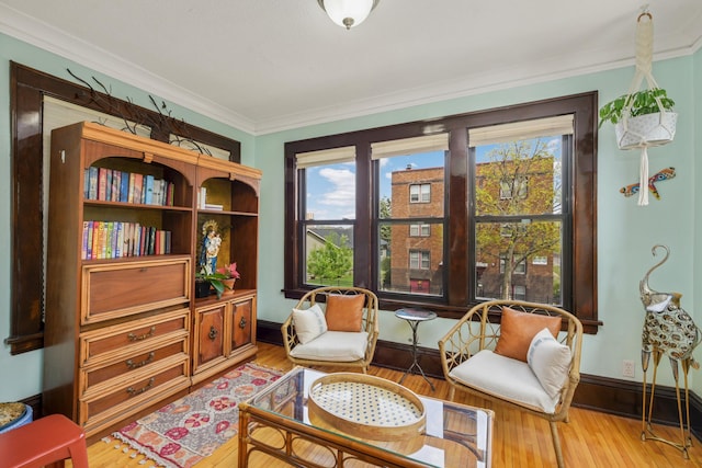 1828 Clinton Ave Unit 3, Minneapolis, MN 55404 - sitting room featuring plenty of natural light, light wood finished floors, ornamental molding, and baseboards