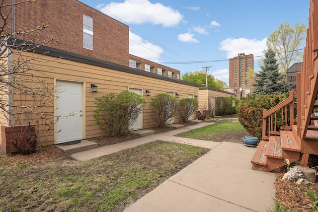 1828 Clinton Ave Unit 3, Minneapolis, MN 55404 - view of yard featuring a patio and stairway