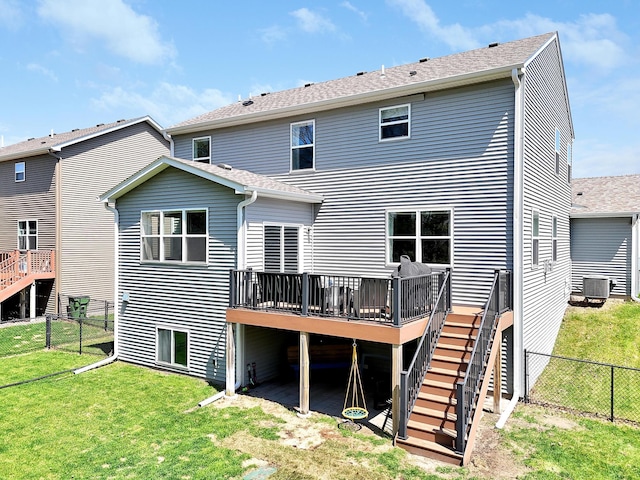 rear view of property featuring stairway, a wooden deck, cooling unit, and roof with shingles