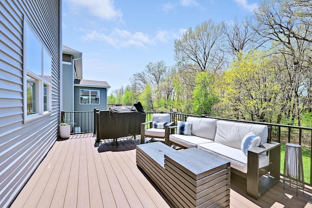 wooden deck with outdoor lounge area