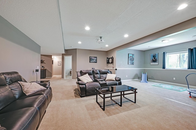 living room featuring light colored carpet, recessed lighting, a textured ceiling, and baseboards