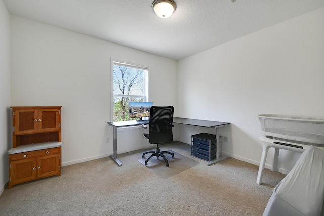 office area with light colored carpet and baseboards