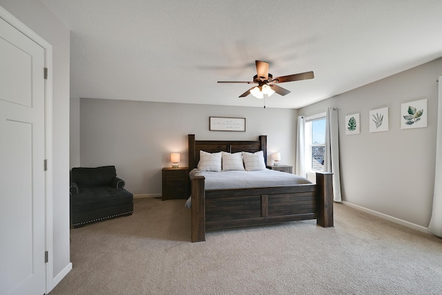bedroom featuring carpet flooring, baseboards, and a ceiling fan