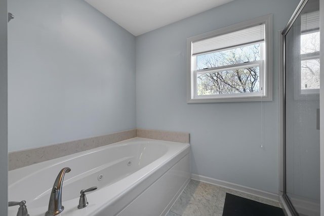 full bath featuring a jetted tub, baseboards, and an enclosed shower