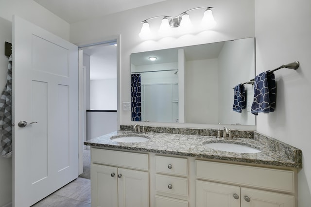 bathroom featuring double vanity and a shower with shower curtain