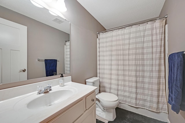 bathroom featuring toilet, vanity, and a textured ceiling