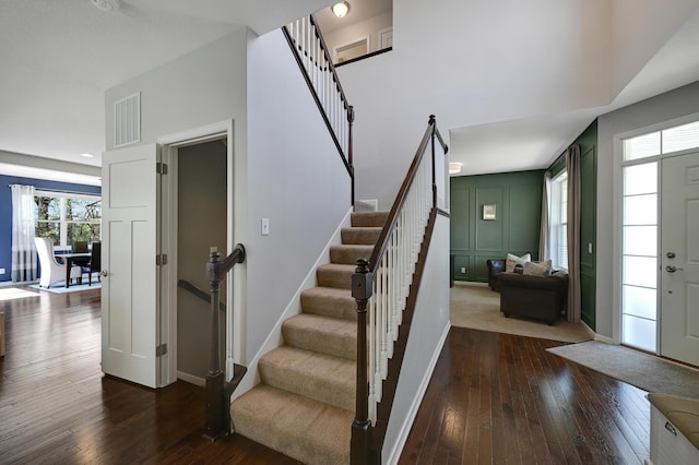 12766 Legacy Creek Pkwy NE, Blaine, MN 55449 - stairs with hardwood / wood-style flooring and baseboards
