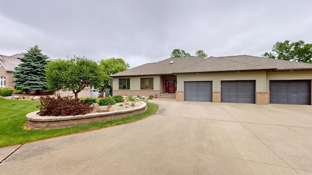 2704 Campus Ln, Albert Lea, MN 56007 - view of front of house featuring an attached garage, driveway, and brick siding