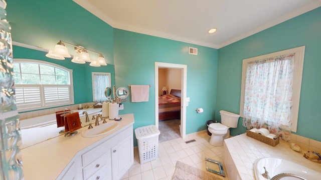 2704 Campus Ln, Albert Lea, MN 56007 - ensuite bathroom featuring vanity, ornamental molding, toilet, a tub to relax in, and tile patterned floors