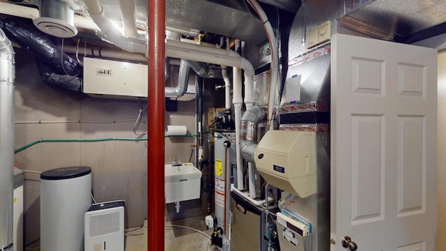 2704 Campus Ln, Albert Lea, MN 56007 - utility room featuring a sink and gas water heater