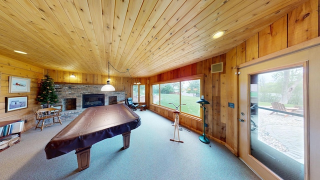 2704 Campus Ln, Albert Lea, MN 56007 - rec room featuring wooden walls, a fireplace, carpet flooring, vaulted ceiling, and wood ceiling