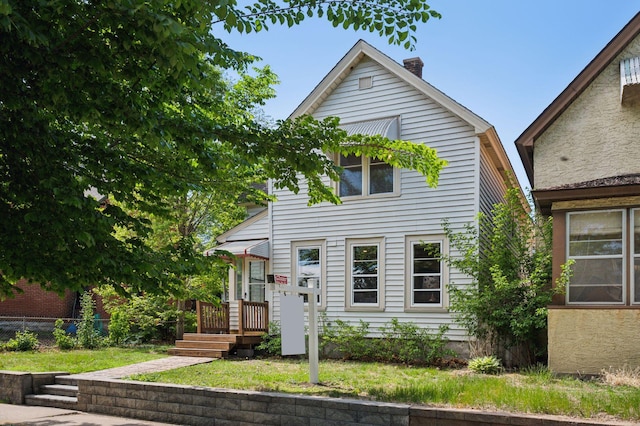 view of front of property with a chimney