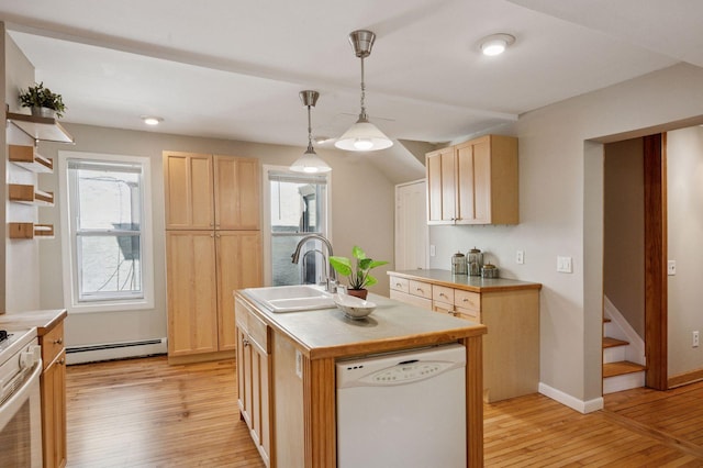 kitchen with white appliances, a baseboard radiator, light brown cabinetry, light wood-style flooring, and light countertops