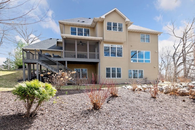 rear view of property featuring roof with shingles, stairs, a ceiling fan, and a deck