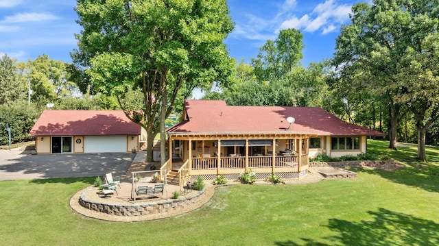 710 Shore Dr W, Orono, MN 55364 - back of house with a yard, driveway, a deck, and an outbuilding